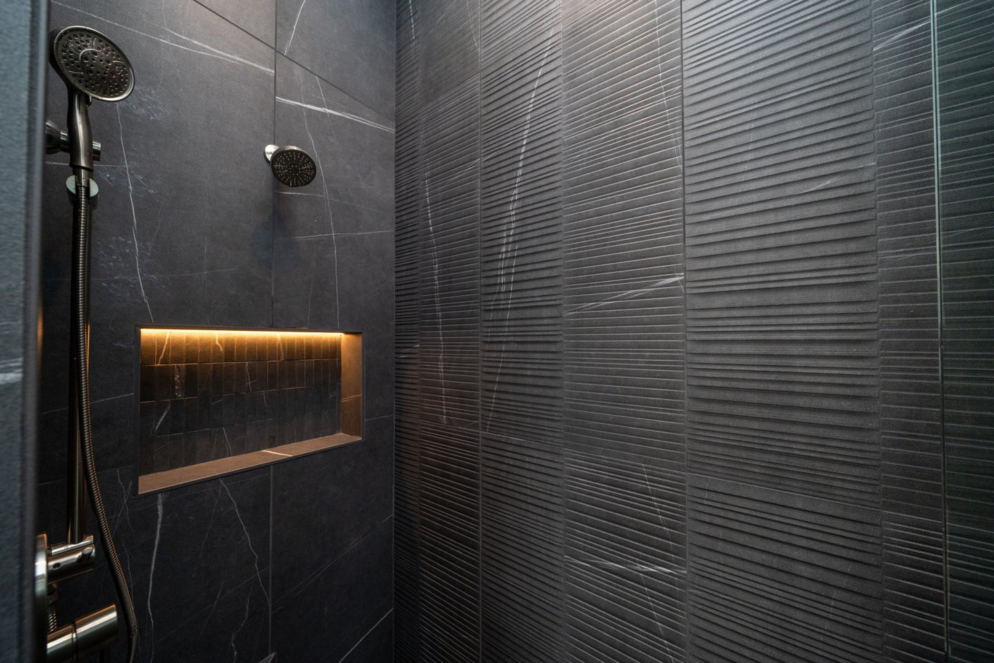 Dark slate shower with textured tile detail
