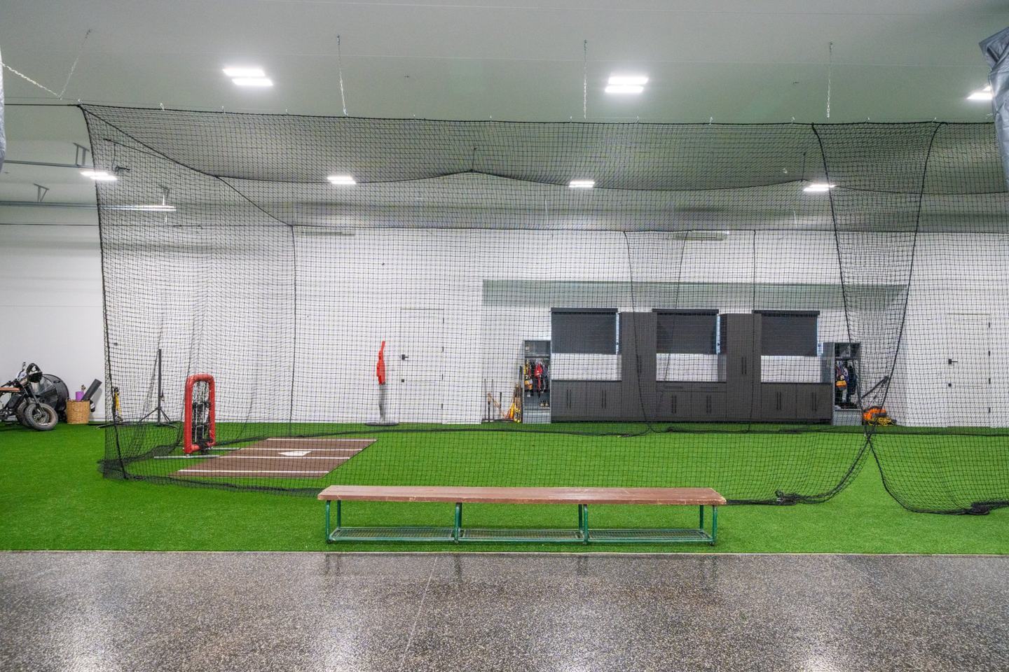 Private indoor batting cage on turf