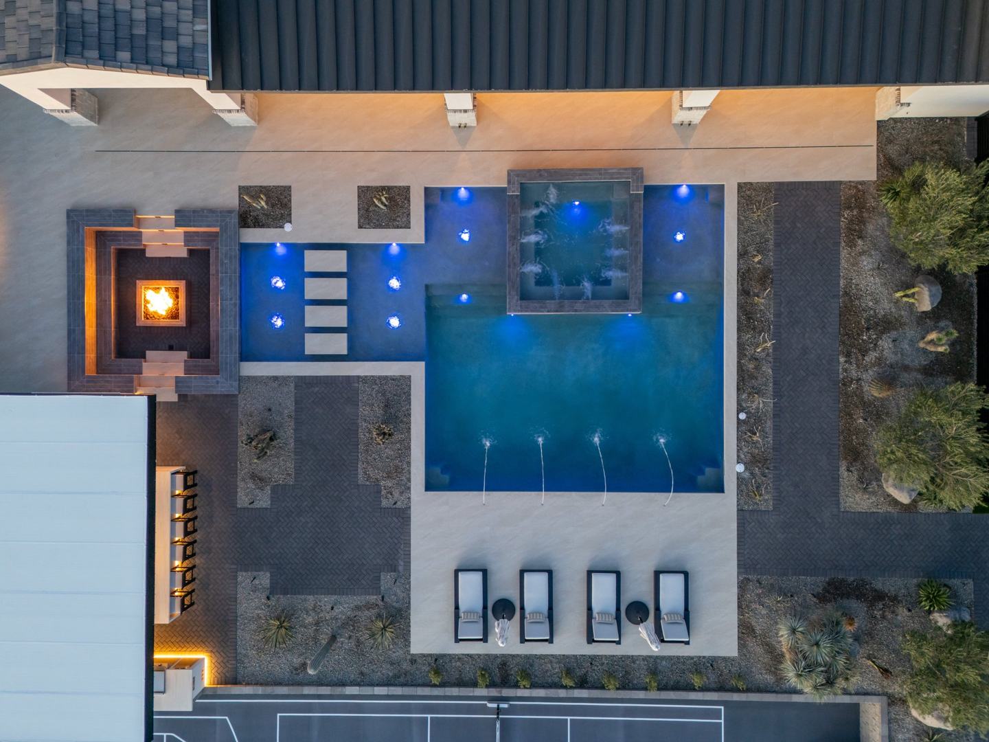Overhead view of the pool, spa, and fire table with lounge seating