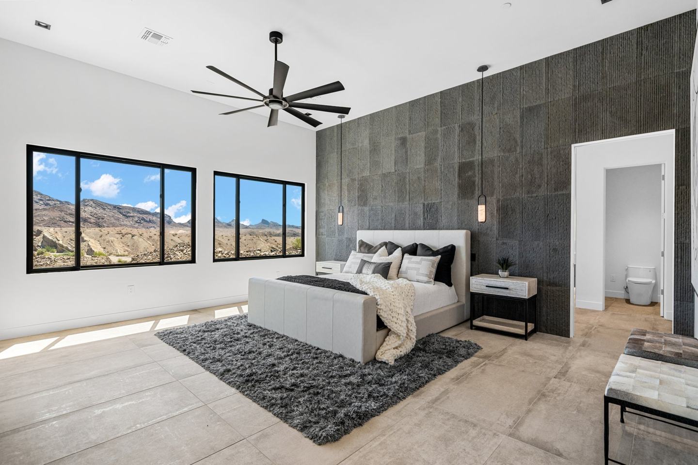 Primary suite with a textured stone accent wall