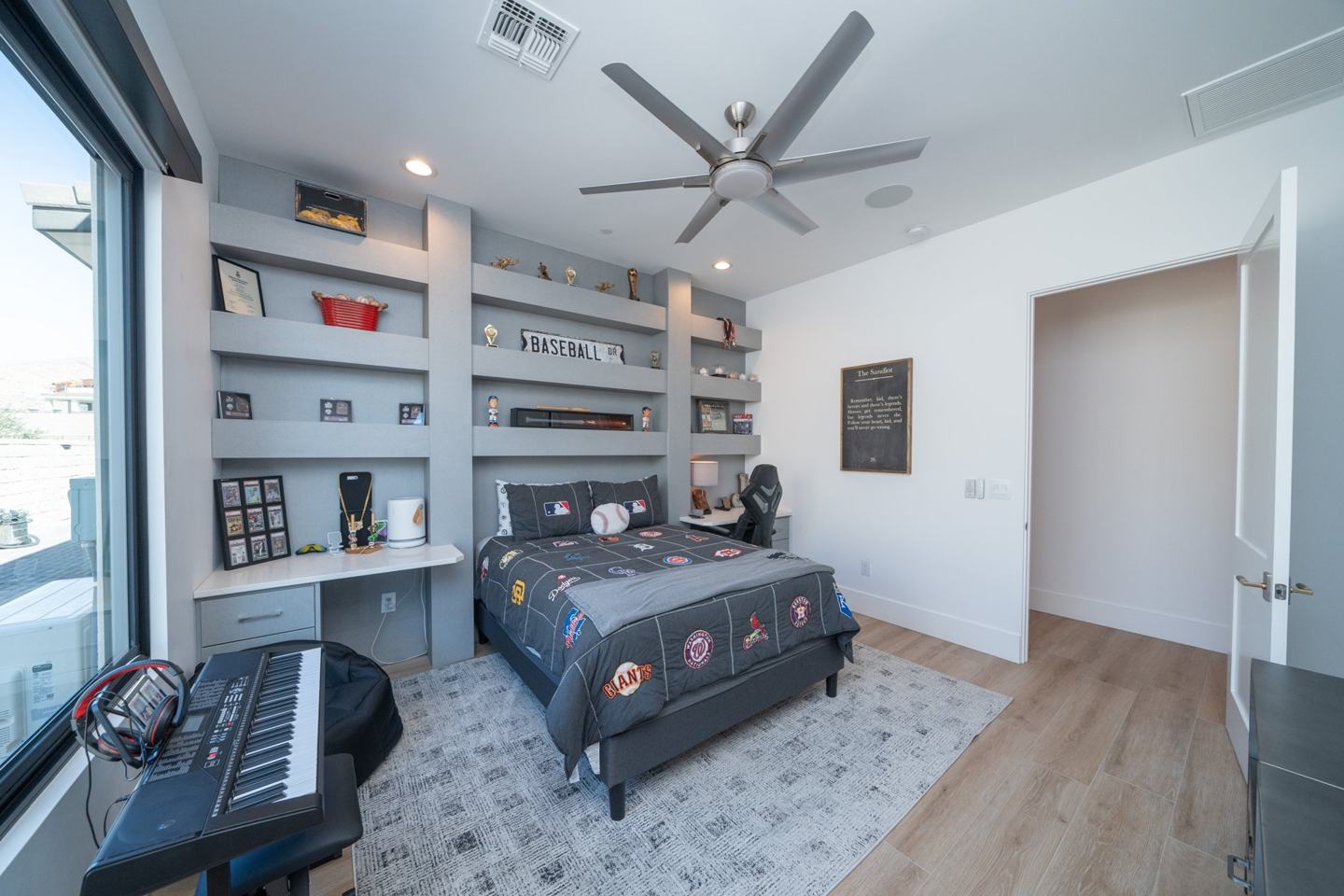 Custom kids room with built-in memorabilia shelving