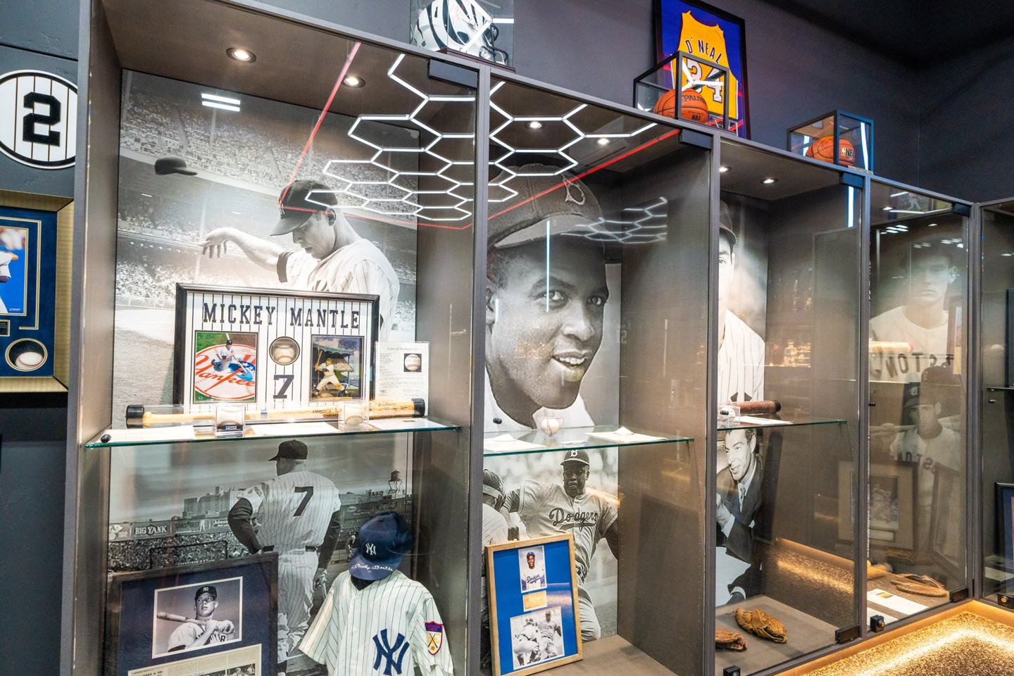 Lit memorabilia display cases and framed jerseys