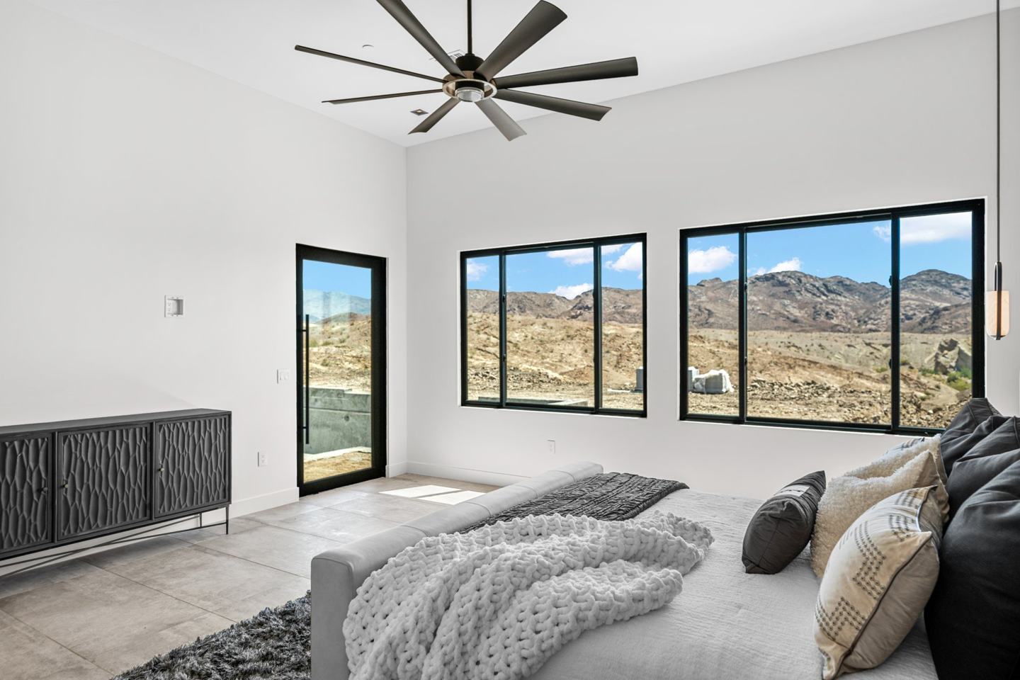Bedroom framing panoramic desert mountain views
