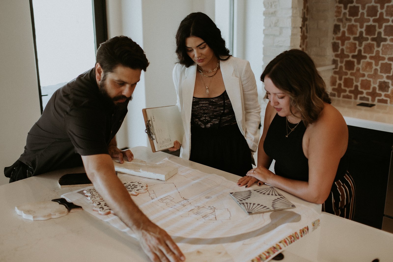 The Janecek Homes team reviewing plans